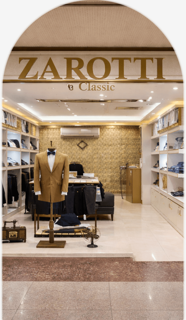 Interior of a Zarotti Classic store with a suit mannequin and shirt displays